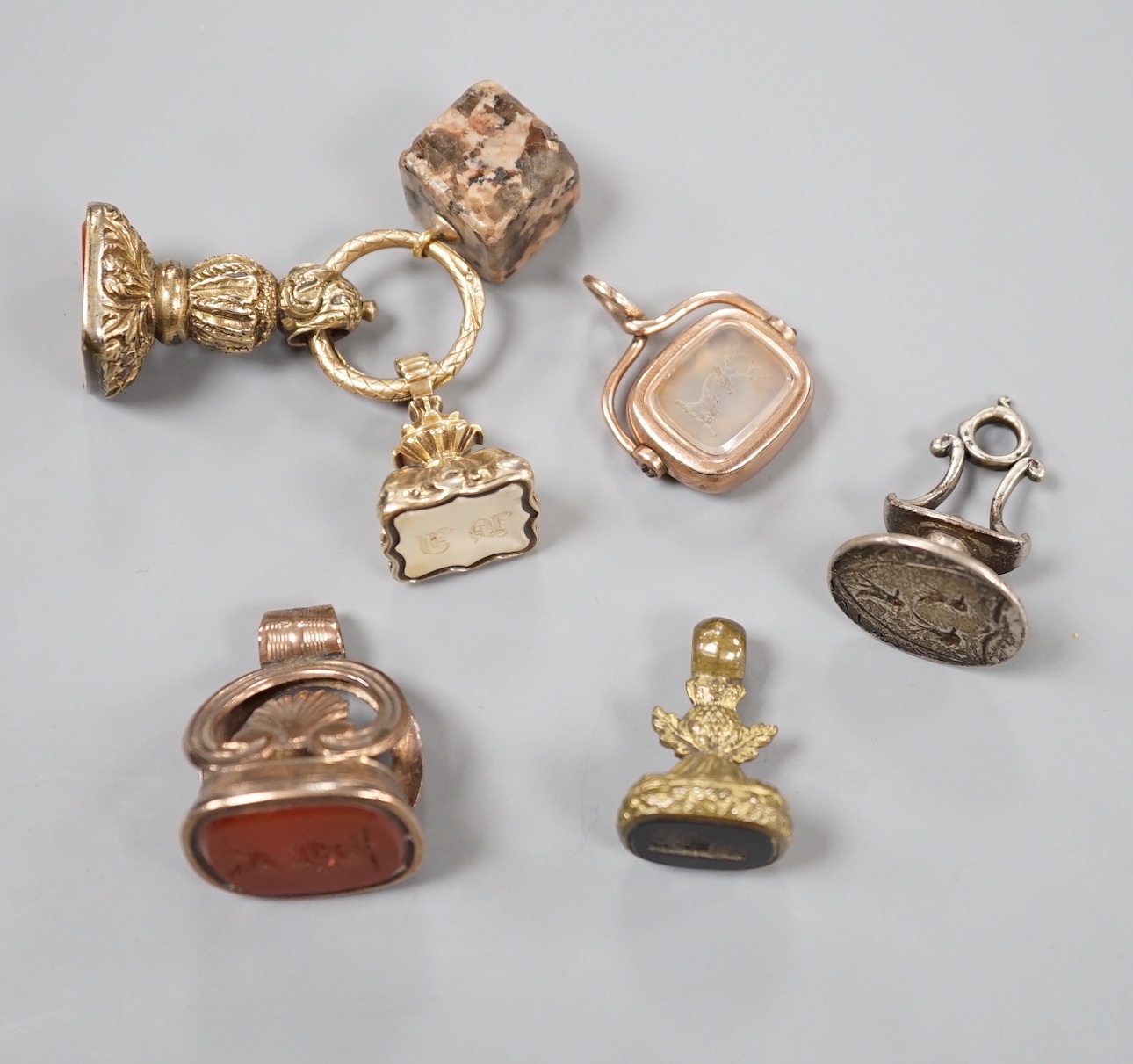 Six assorted Victorian and later mainly carnelian set fob seals including yellow metal overlaid and silver, largest 33mm.